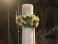 Candle «dressed» with lace and with cymbidium orchids and white freesia ...